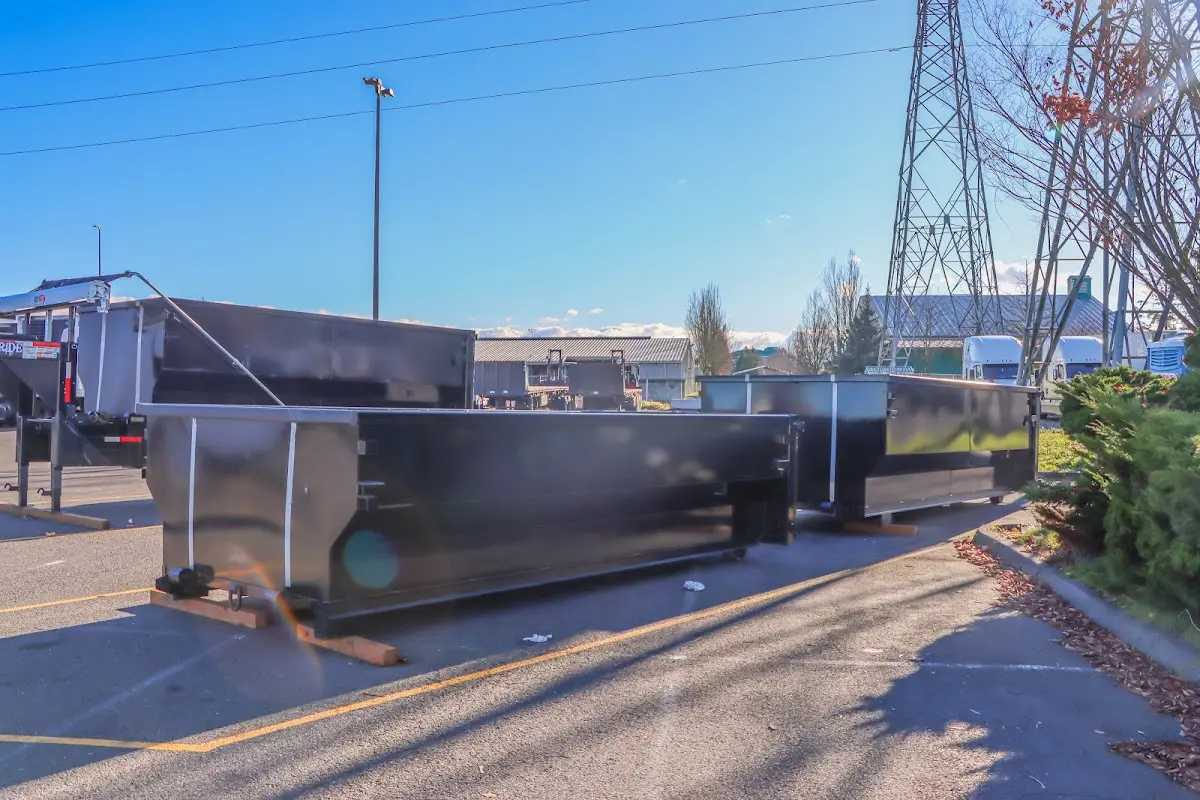 Roll-off dumpster ready for waste disposal at job site for 15 Yard Dumpster Rental in Mobile